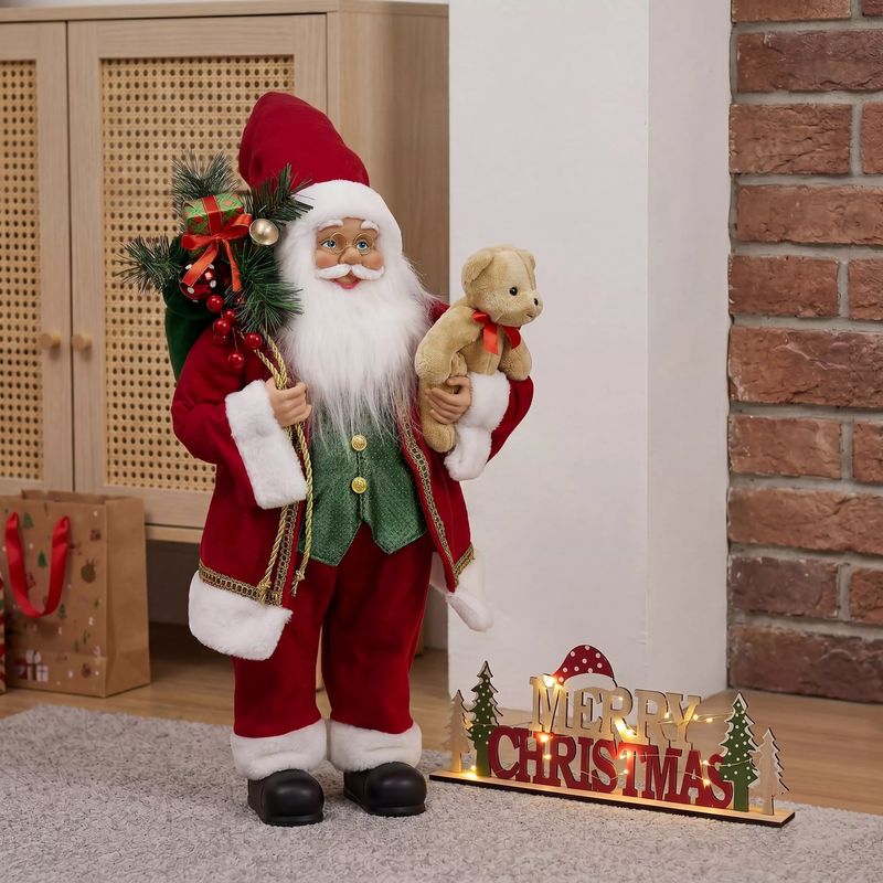A standing Santa figure carrying a sack of presents