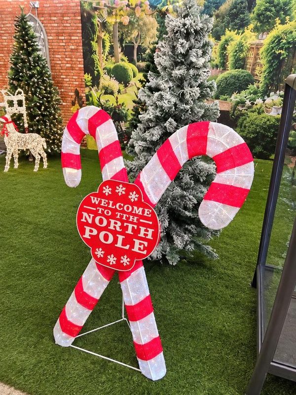 Light-up candy canes and North Pole sign