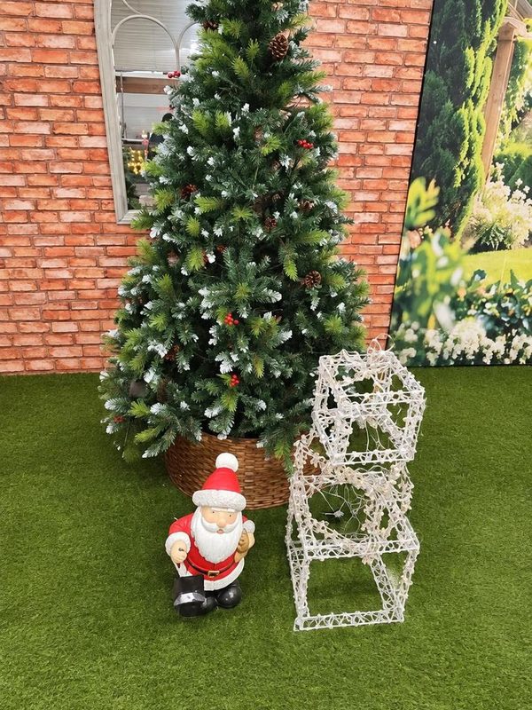 A lit artificial tree with a Santa and light-up presents